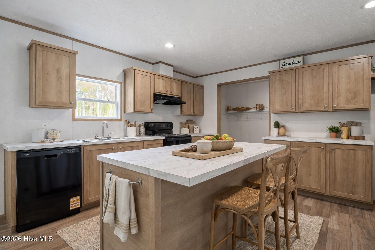1735 Lynch Road Hollister, NC 27844 - Photo 9 of 39 Bright farmhouse-style kitchen with isla