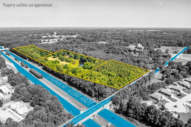 a view of a large body of water with lots of green space