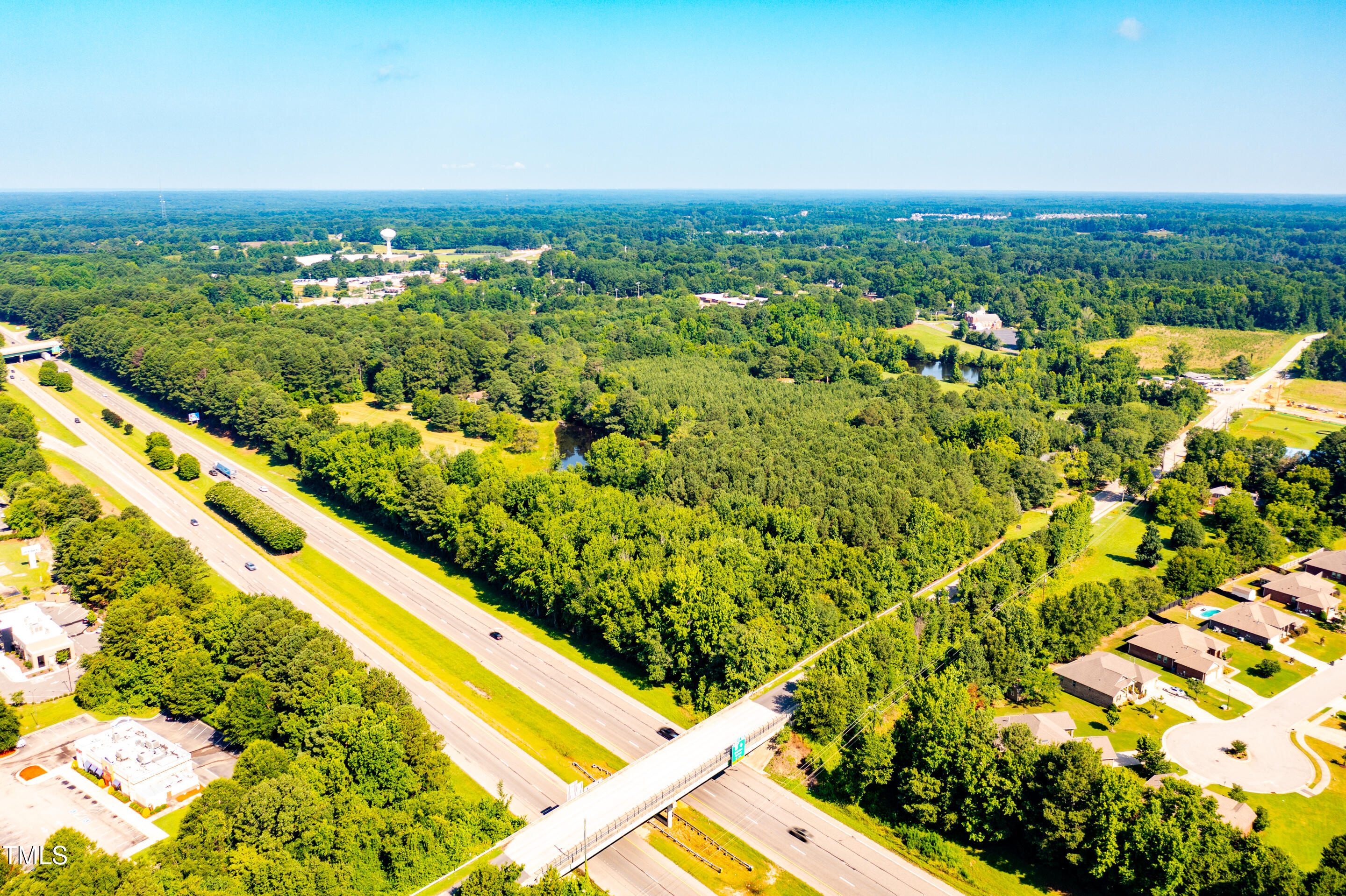 1213 Shepard School Road Zebulon, NC 27597 - Photo 5 of 8 a view of a large body of water with lots of green space