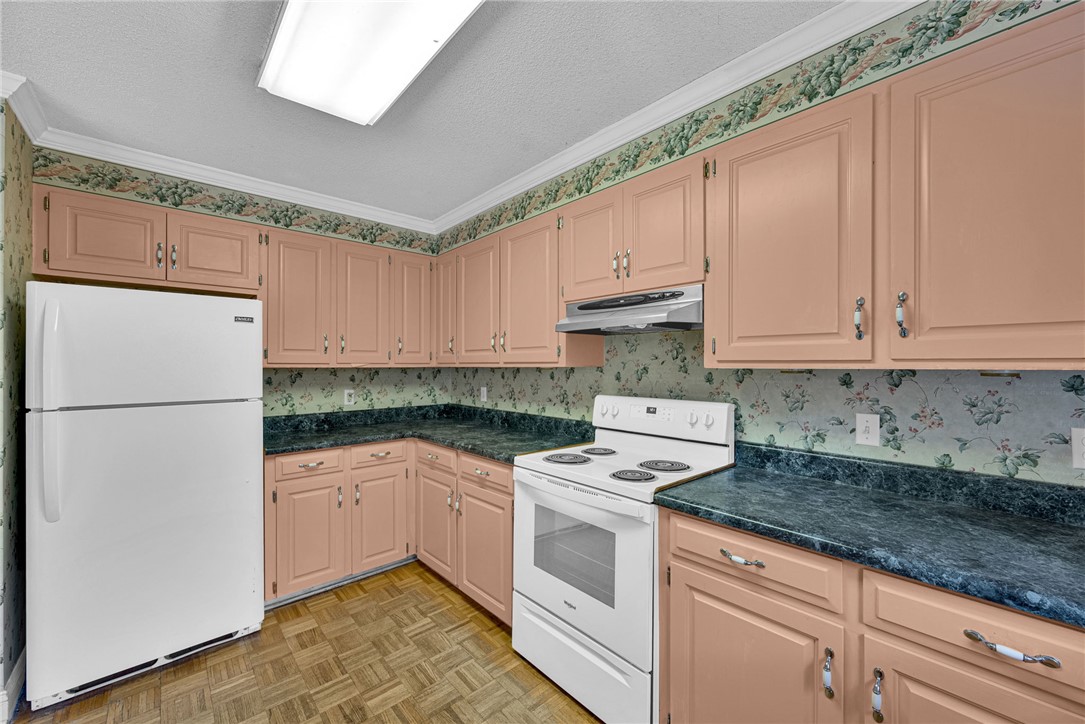 1016 Campbell Road Belton, SC 29627 - Photo 13 of 50 Well-appointed kitchen featuring ample cabinetry, practical appliances, and a durable flooring.