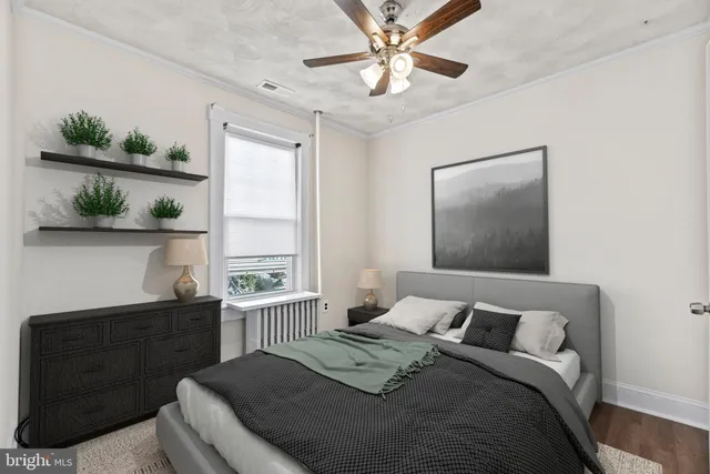 a bedroom with a large bed and a window