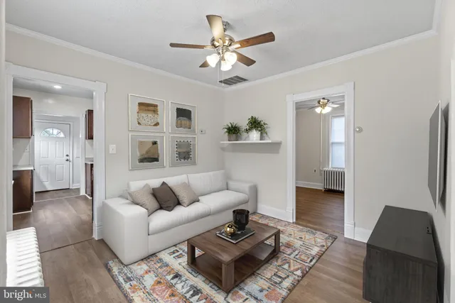 a living room with furniture and a rug
