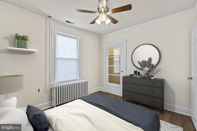 a bedroom with a bed and a mirror