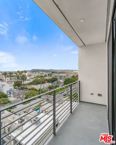 a view of balcony with furniture