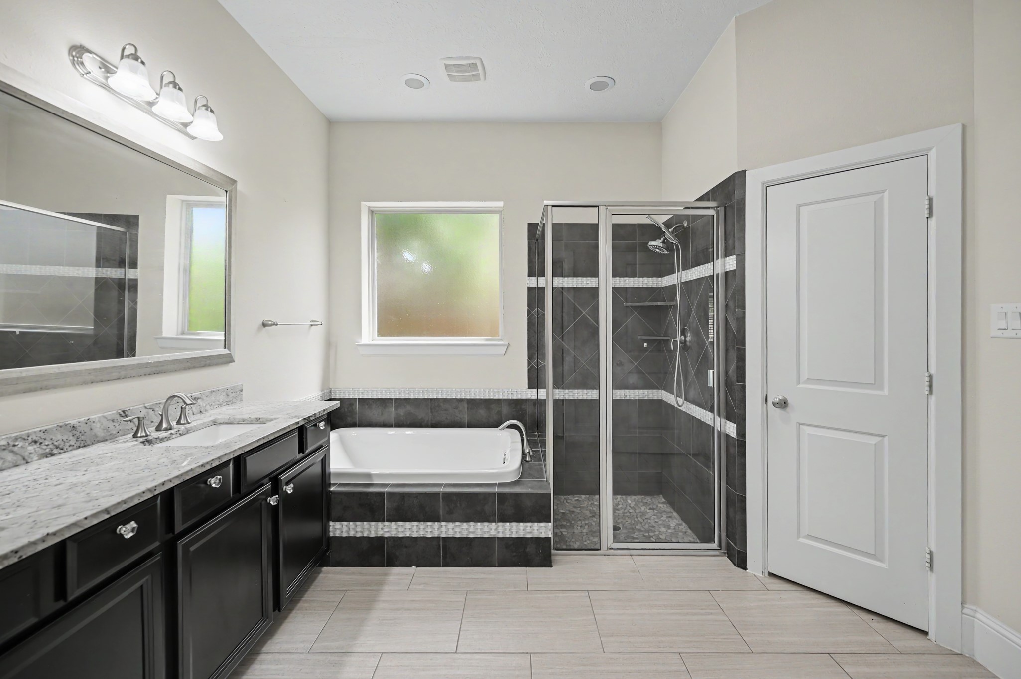 31325 Riley Woods Court Spring, TX 77386 - Photo 25 of 50 Primary bath features a dual sink vanity with counter space and water closet.