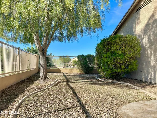 a view of a backyard of the house