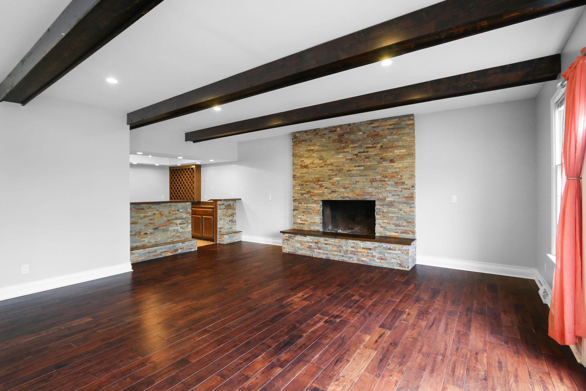 366 Devon Court Valparaiso, IN 46385 - Photo 12 of 45 a view of an empty room with wooden floor fireplace and a window
