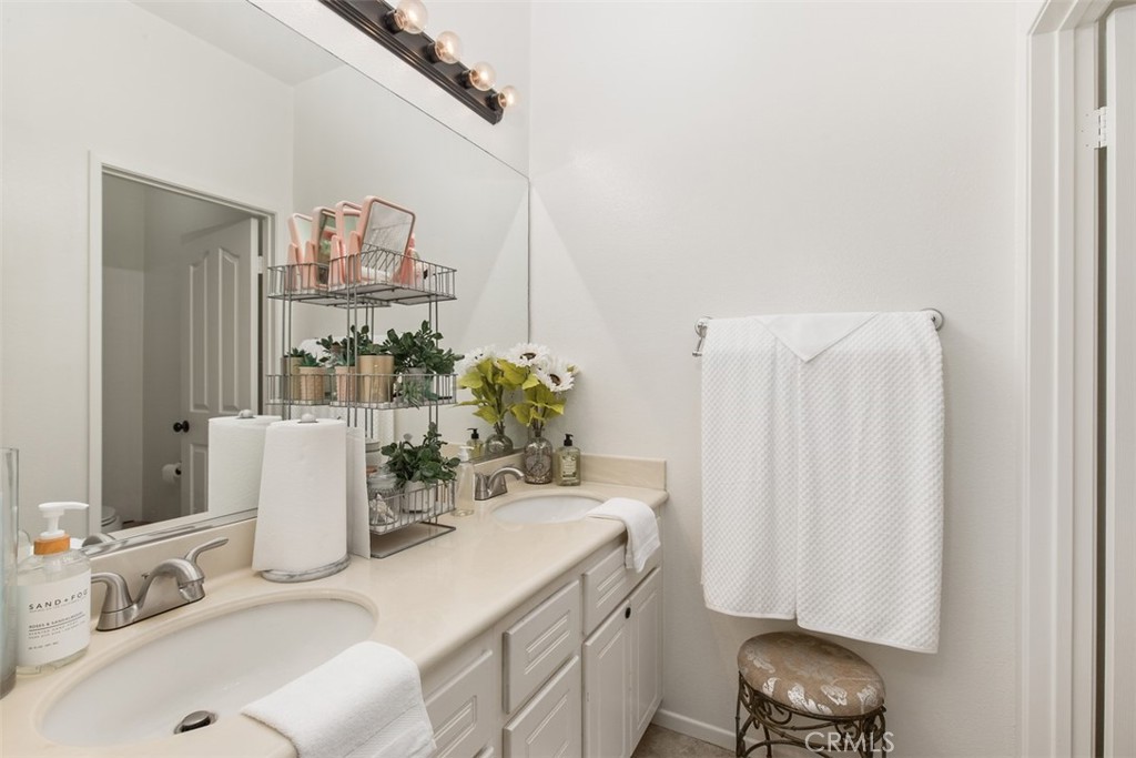 32095 Zion Way Winchester, CA 92596 - Photo 18 of 30 a bathroom with a sink and a mirror