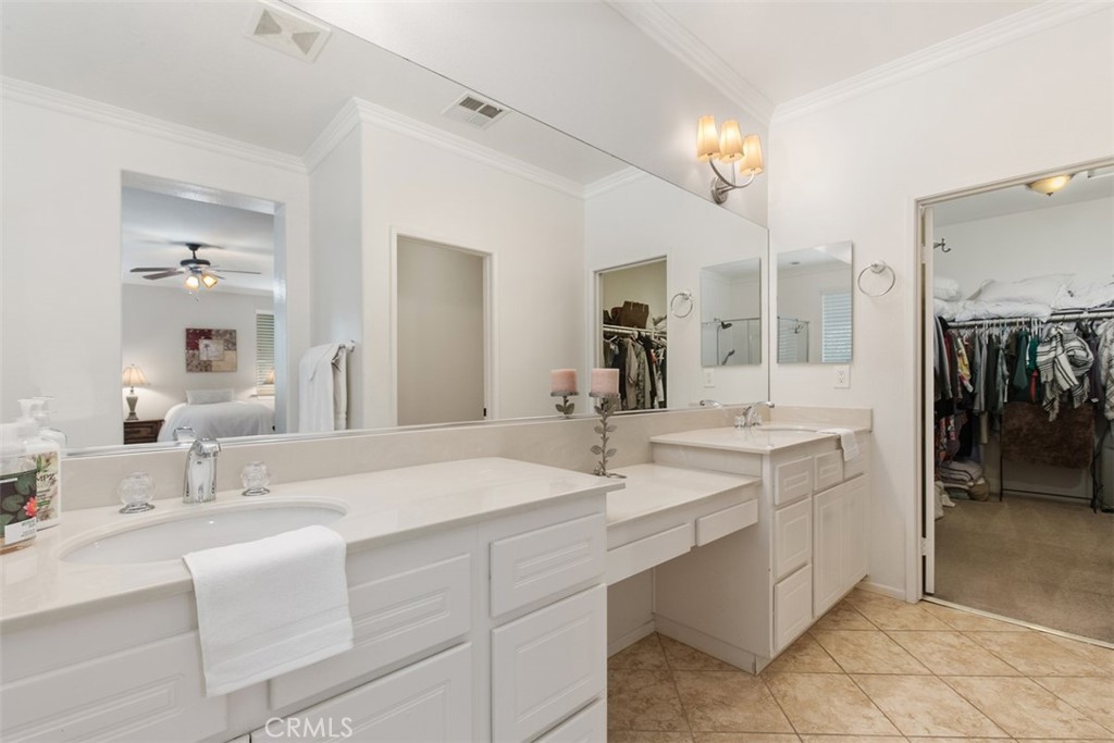 32095 Zion Way Winchester, CA 92596 - Photo 25 of 30 a bathroom with double vanity sinks and a mirror