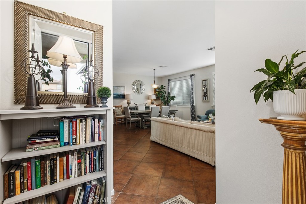 32095 Zion Way Winchester, CA 92596 - Photo 3 of 30 a living room with furniture and a book shelf