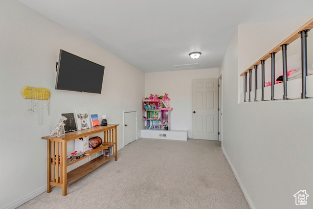 360 East Center Street Centerville, UT 84014 - Photo 26 of 41 Recreation room featuring light carpet and baseboards