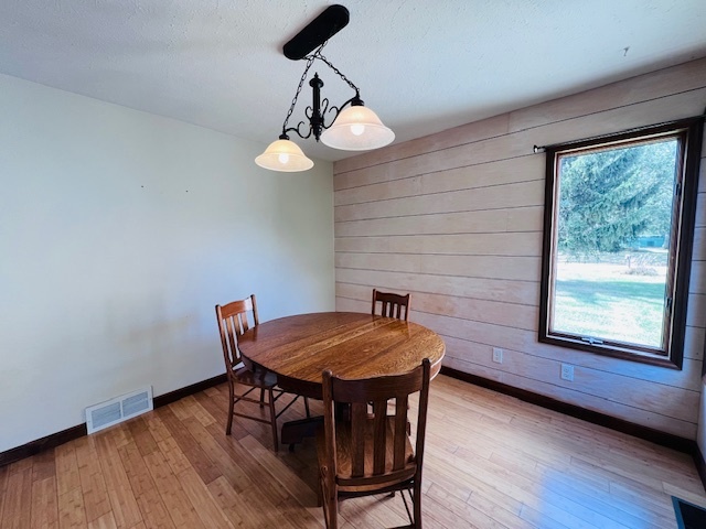 7705 Lakewood Road Weldon, IL 61882 - Photo 16 of 40 a view of a dining room with furniture window and wooden floor