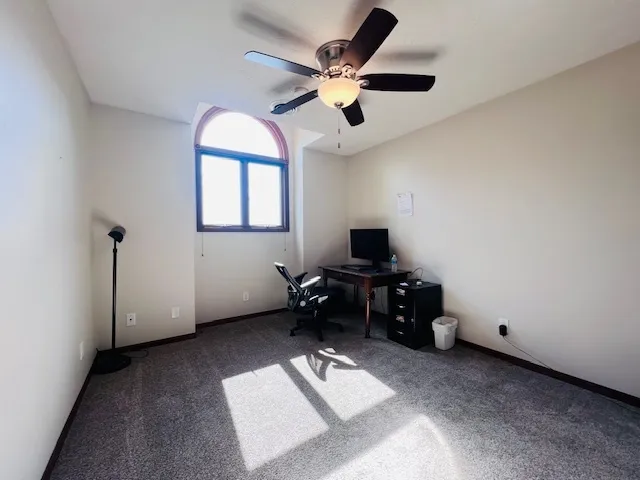 a bedroom with furniture and window