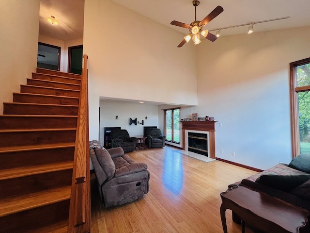 7705 Lakewood Road Weldon, IL 61882 - Photo 7 of 40 a living room with furniture and a fireplace