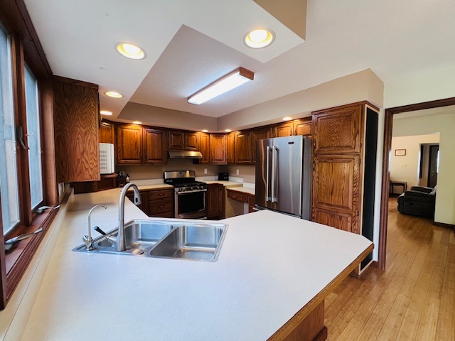 7705 Lakewood Road Weldon, IL 61882 - Photo 10 of 40 a large kitchen with a large counter top appliances and cabinets