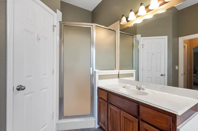 a bathroom with a sink double vanity and a mirror