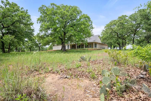 a view of a lake with a house in the background