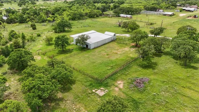 a view of a lake with houses in back