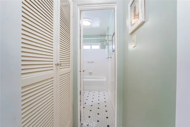 a bathroom with a shower and a sink