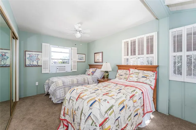 a bedroom with double bed and a window