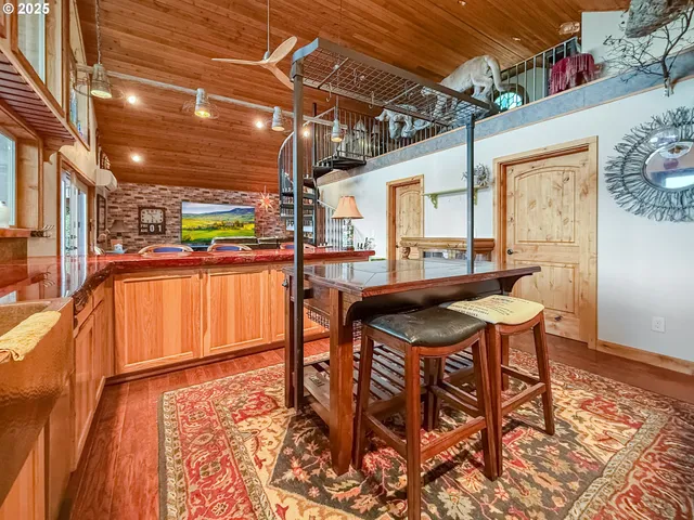 a outdoor dining space with chairs and window
