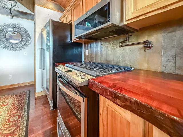 a bedroom with a bed and a stove