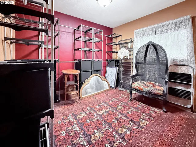 a bedroom with bed and a mirror