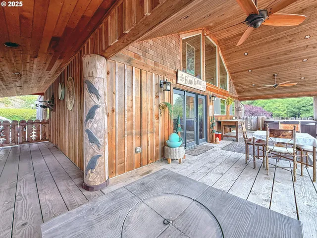 a balcony with furniture and wooden floor