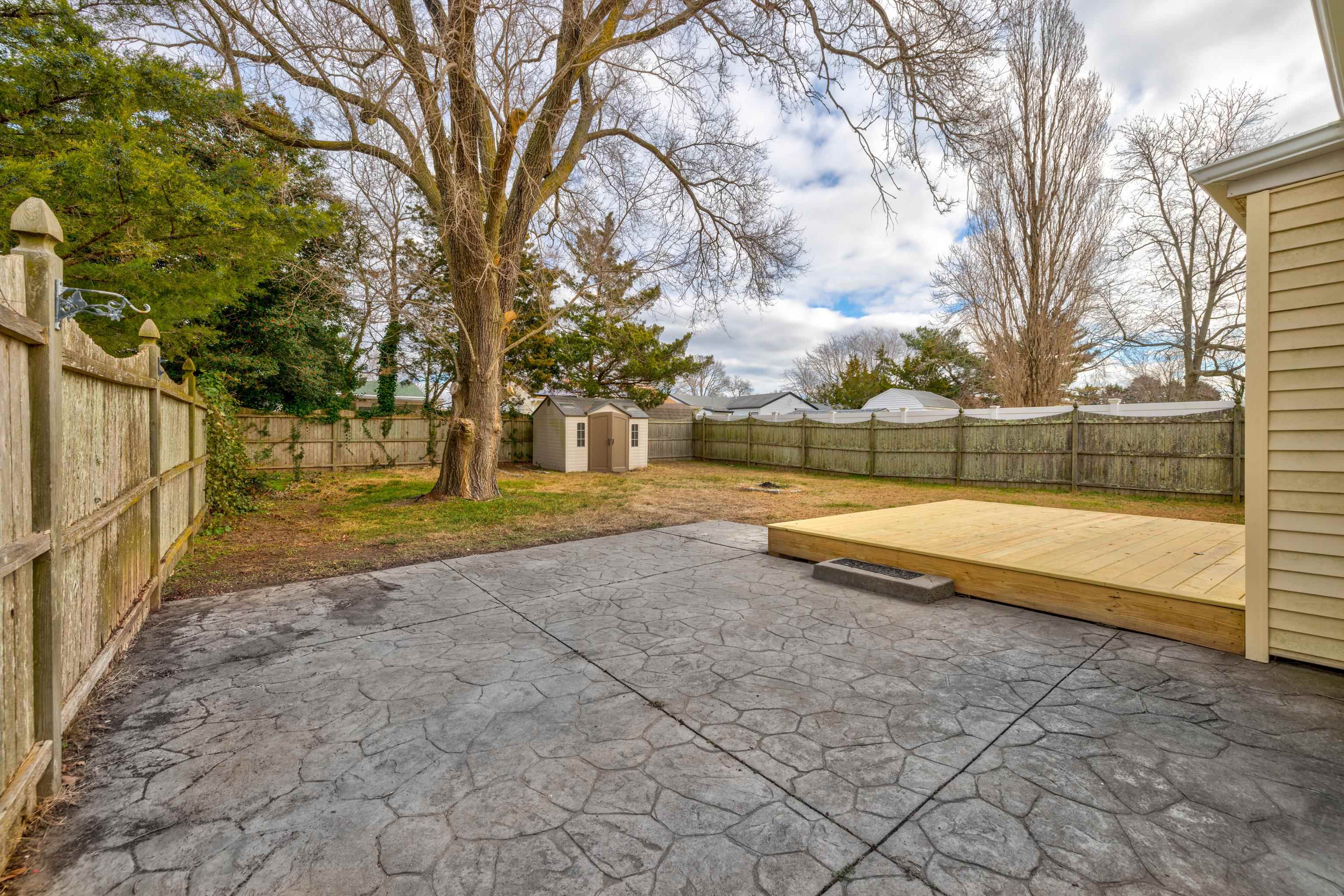121 Broadway Villas, NJ 08251 - Photo 13 of 32 a view of yard with swimming pool and wooden fence
