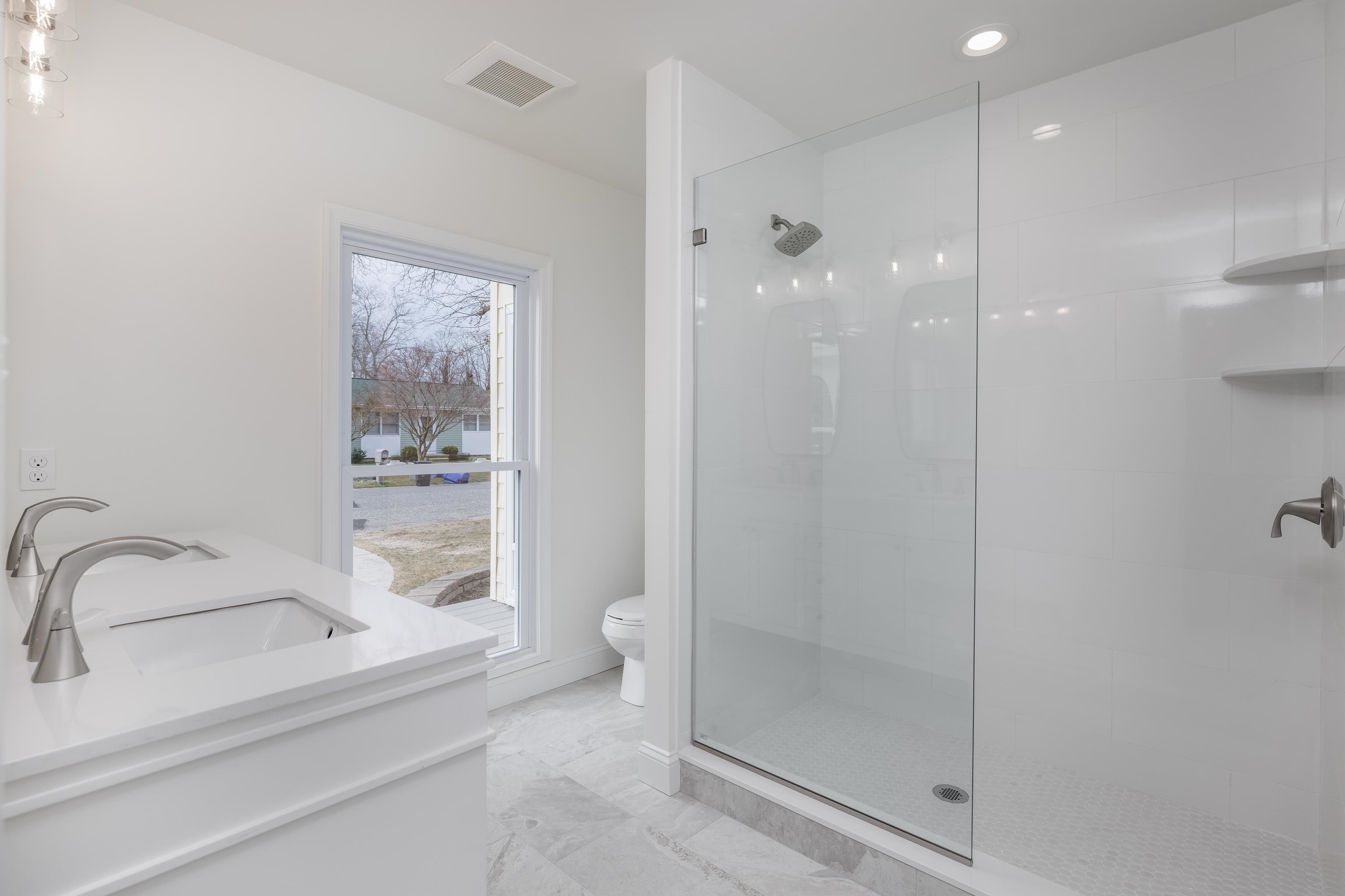 121 Broadway Villas, NJ 08251 - Photo 24 of 32 a bathroom with a shower and a sink