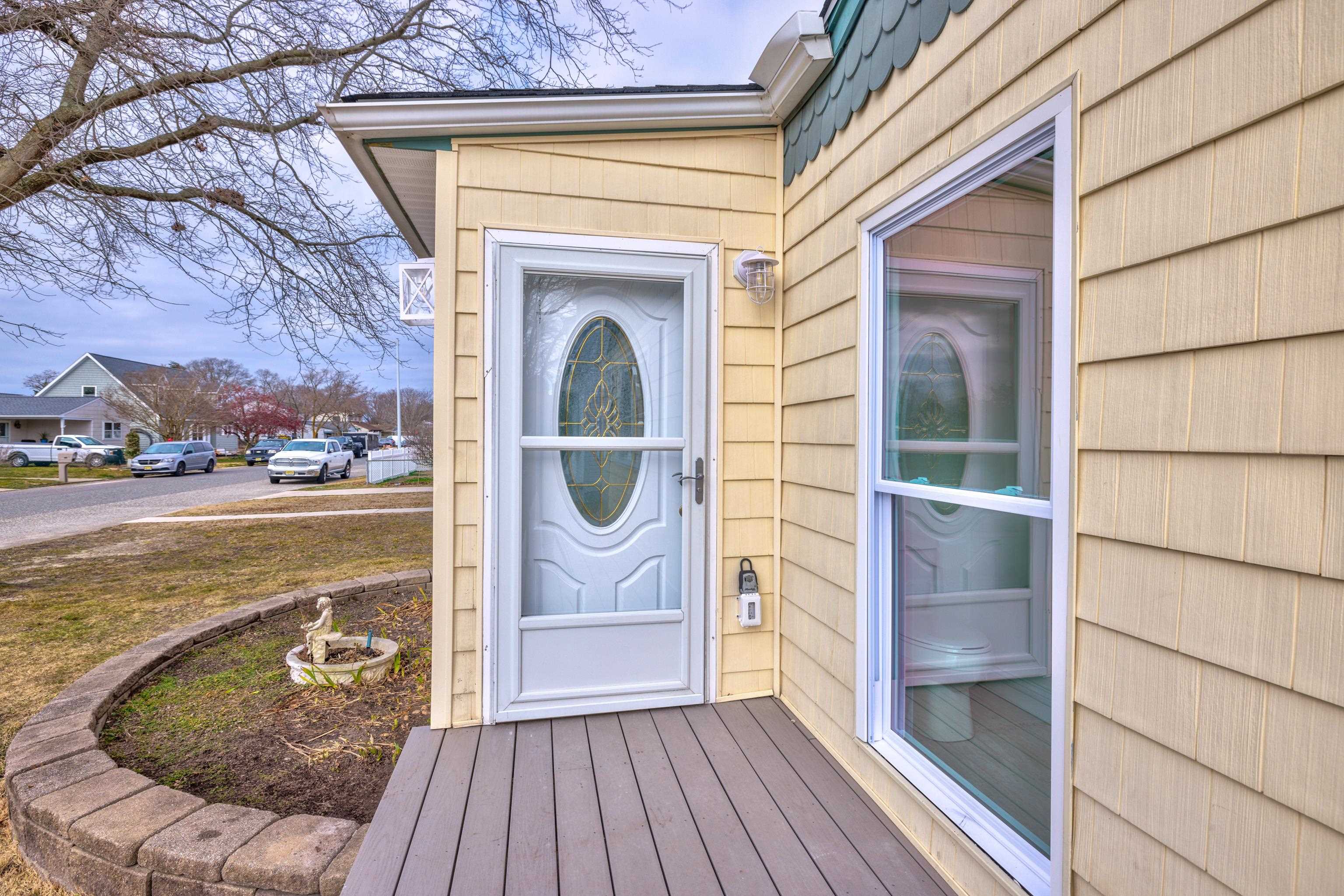 121 Broadway Villas, NJ 08251 - Photo 4 of 32 a view of a balcony with wooden floor and iron fence