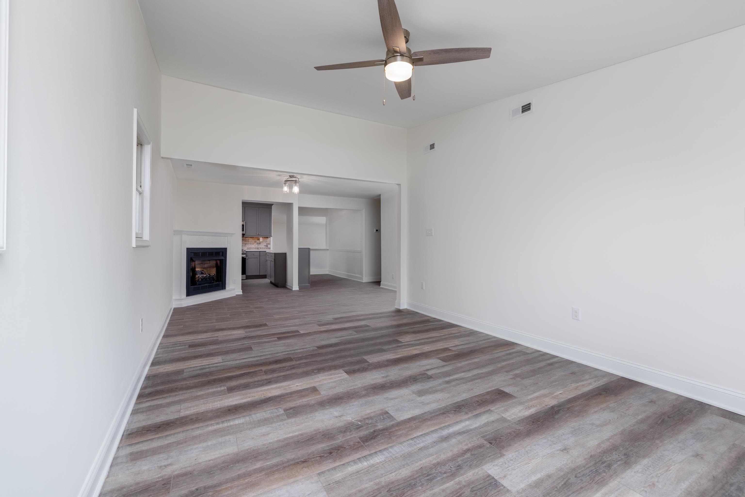 121 Broadway Villas, NJ 08251 - Photo 9 of 32 a view of empty room with wooden floor and fan