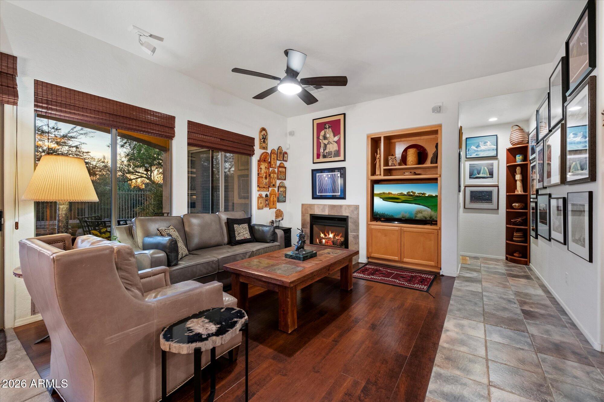 5025 East Kirkland Road Phoenix, AZ 85054 - Photo 10 of 37 a living room with fireplace furniture and a large window