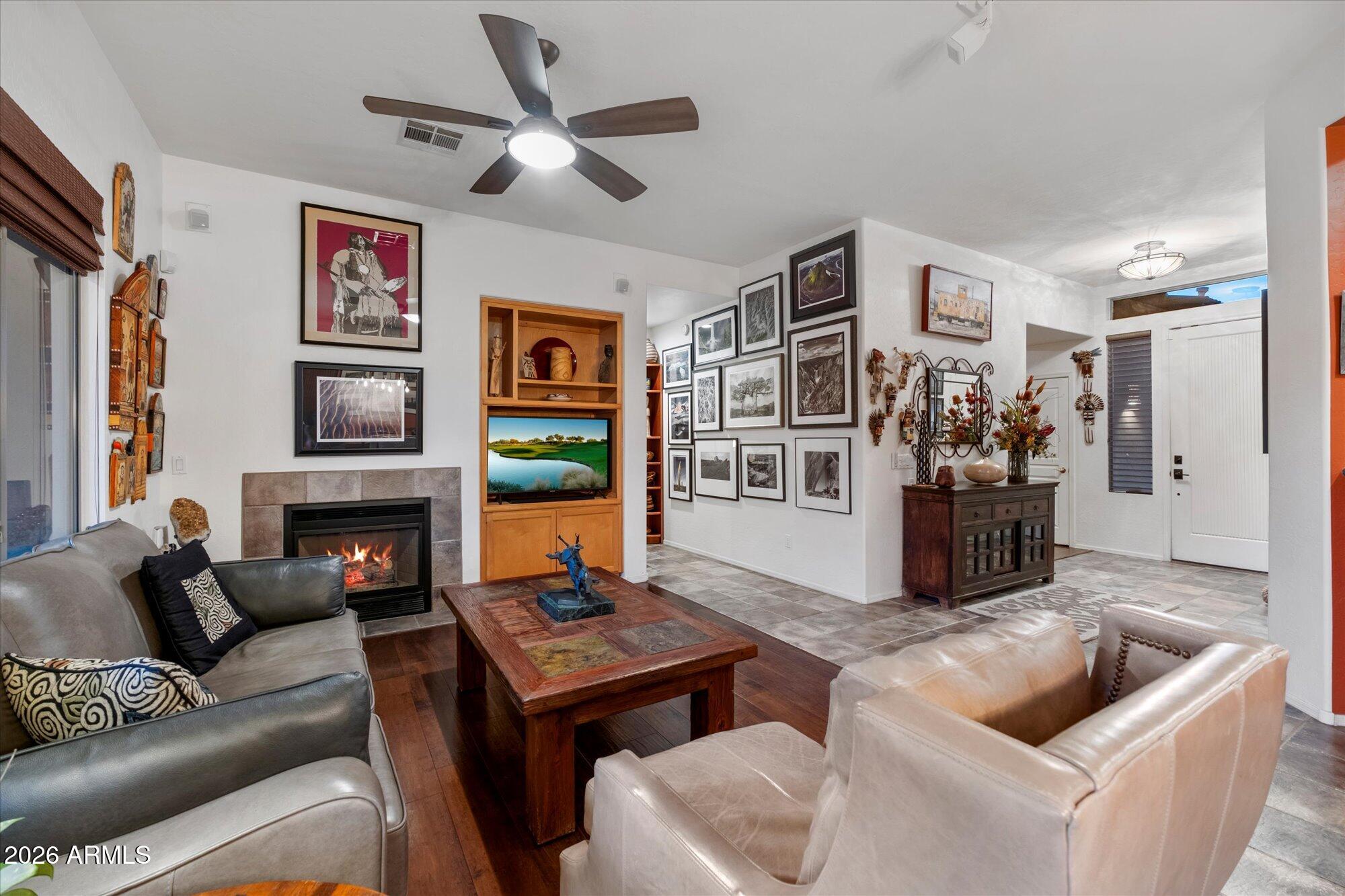 5025 East Kirkland Road Phoenix, AZ 85054 - Photo 11 of 37 a living room with furniture and a fireplace