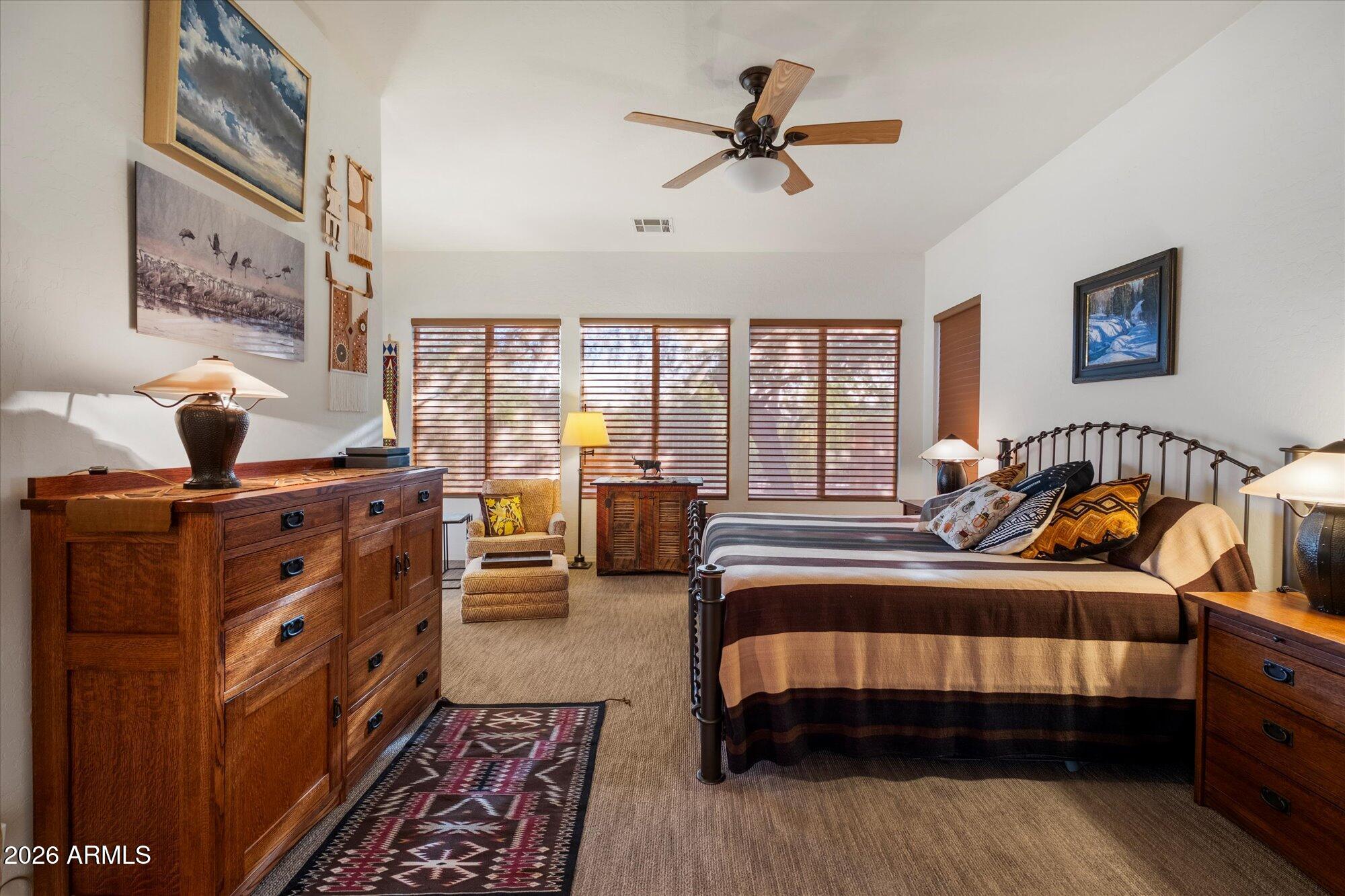 5025 East Kirkland Road Phoenix, AZ 85054 - Photo 19 of 37 a bedroom with furniture and a window
