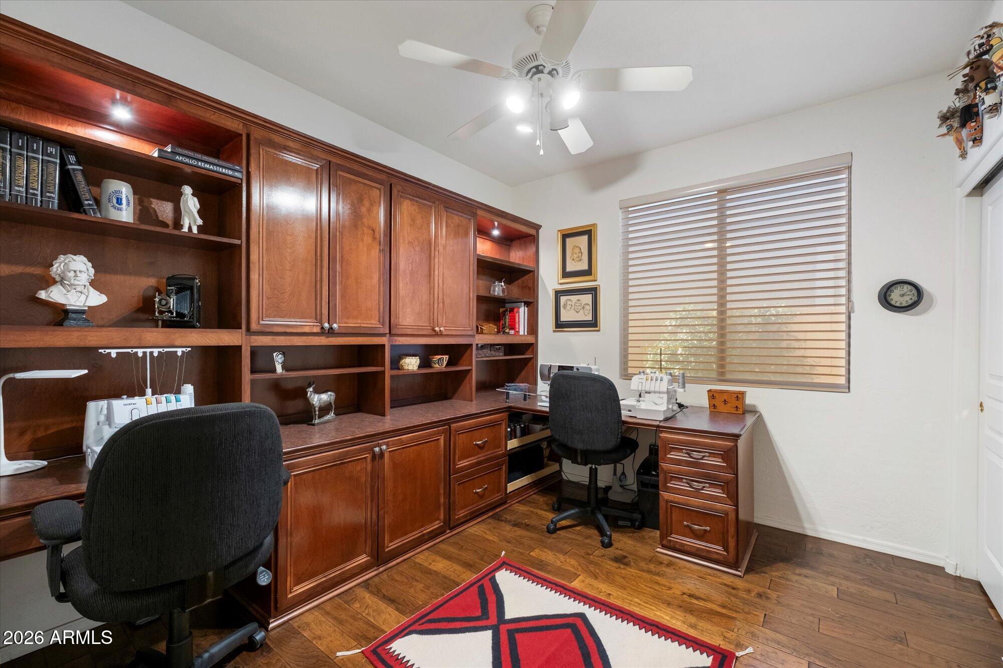 5025 East Kirkland Road Phoenix, AZ 85054 - Photo 24 of 37 a work room with furniture and a bookshelf