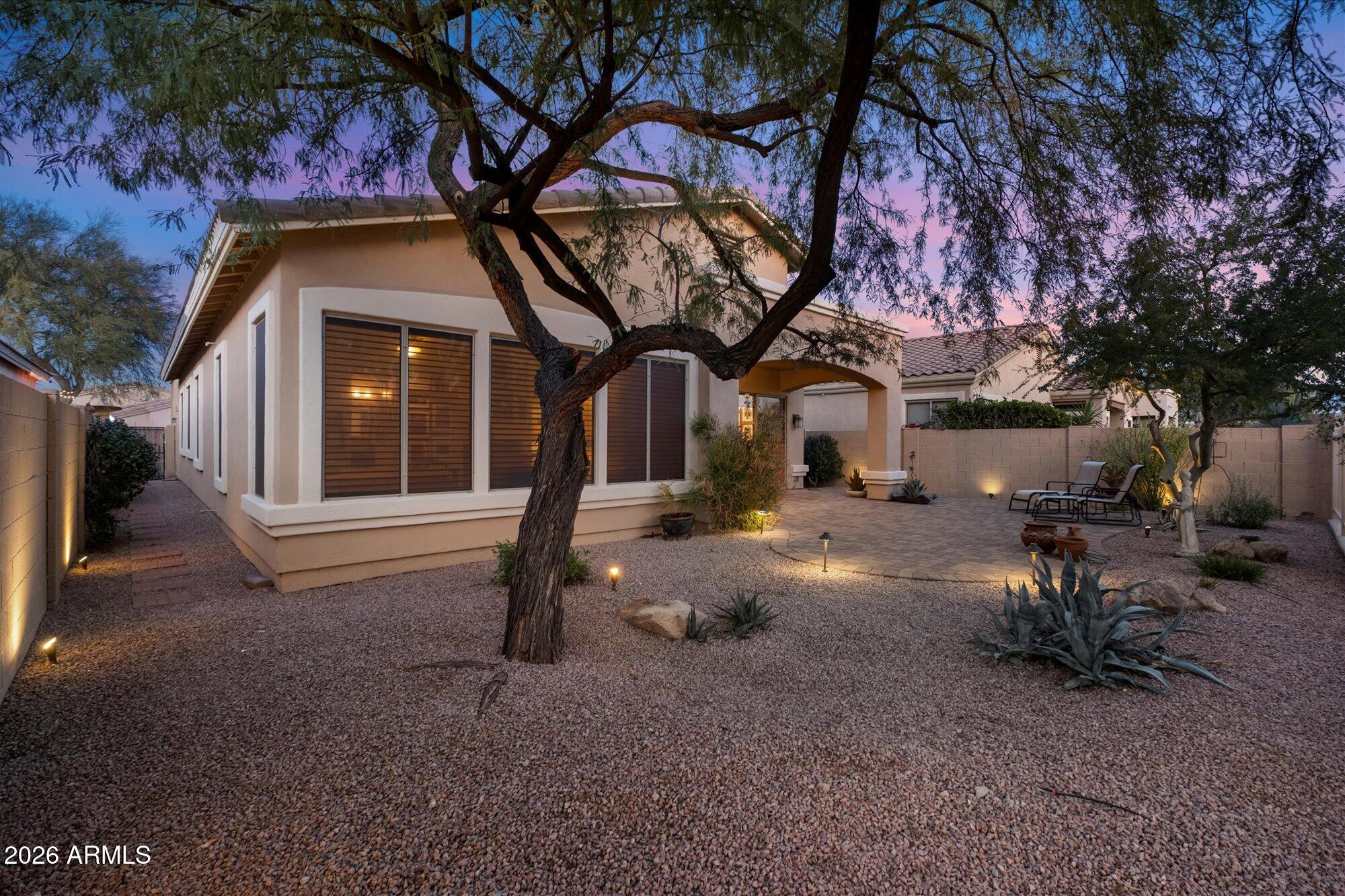5025 East Kirkland Road Phoenix, AZ 85054 - Photo 29 of 37 a house view with a sitting space and garden