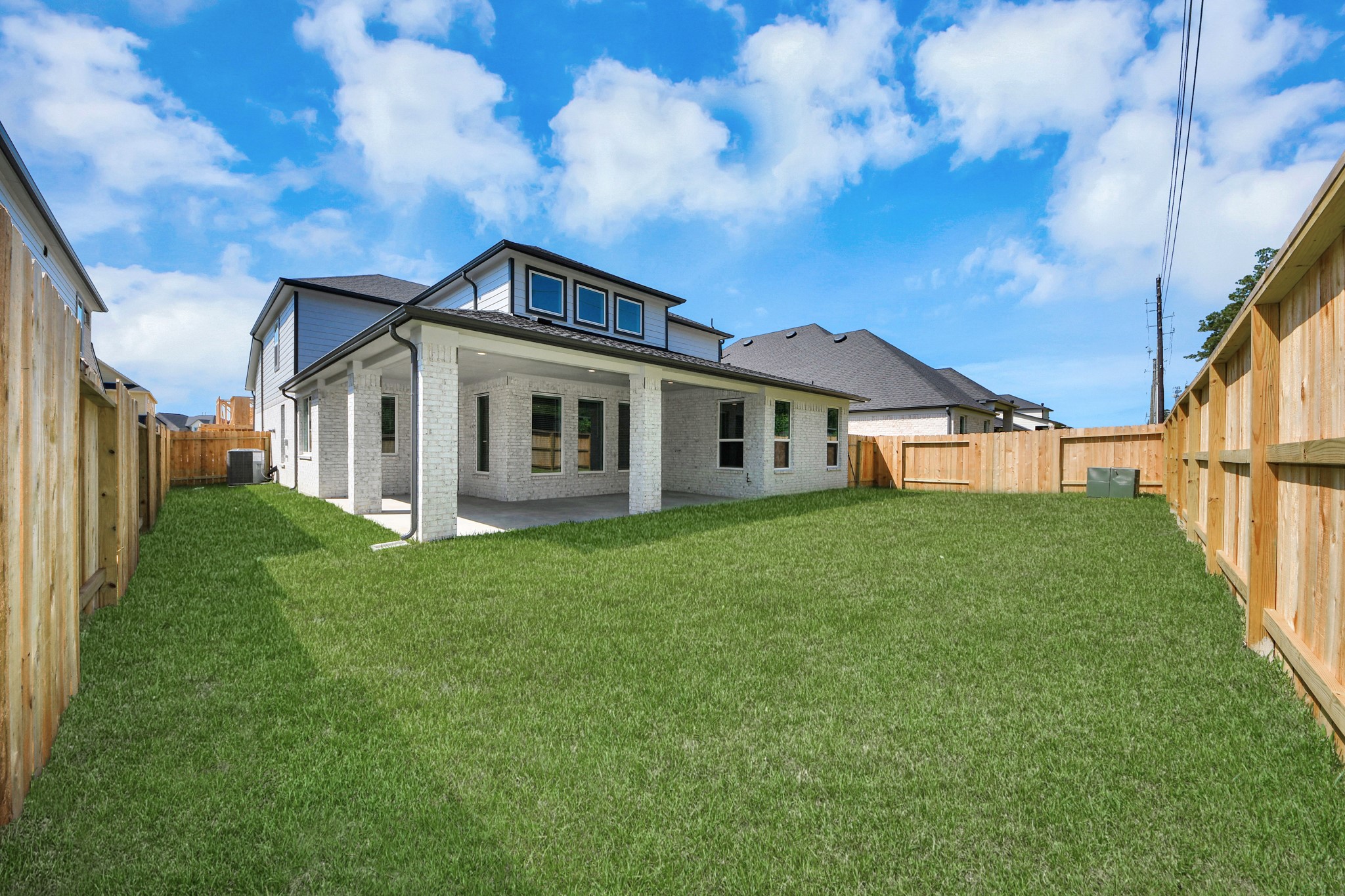 3035 Native Spg Drive Spring, TX 77373 - Photo 8 of 43 Discover the charm of this spacious backyard featuring a delightful covered patio. With ample room for both play and relaxation, it's the perfect outdoor haven. Tailor this space to your liking with patio furniture, a BBQ pit, and more. The potential for creating your dream outdoor living area is limitless!