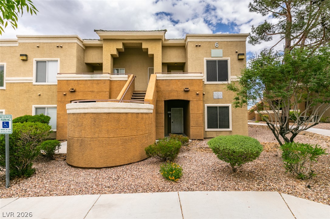 8070 West Russell Road, Unit 2026 Las Vegas, NV 89113 - Photo 39 of 41 A desert-friendly landscape surrounds this multi-level residential building, offering easy access.