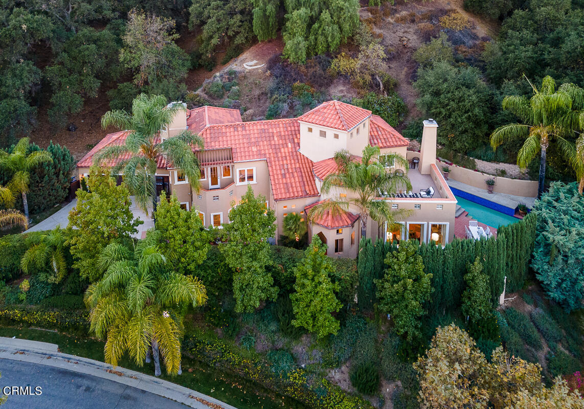 an aerial view of house with yard