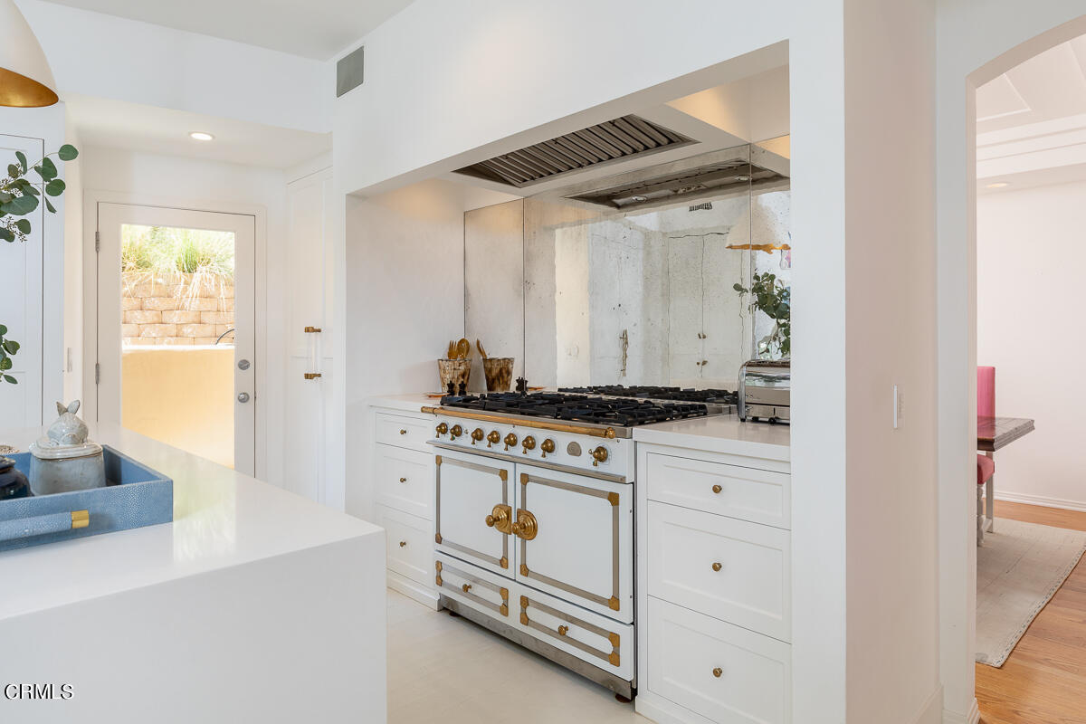 1437 Rutherford Drive Pasadena, CA 91103 - Photo 12 of 44 a stove top oven sitting inside of a kitchen