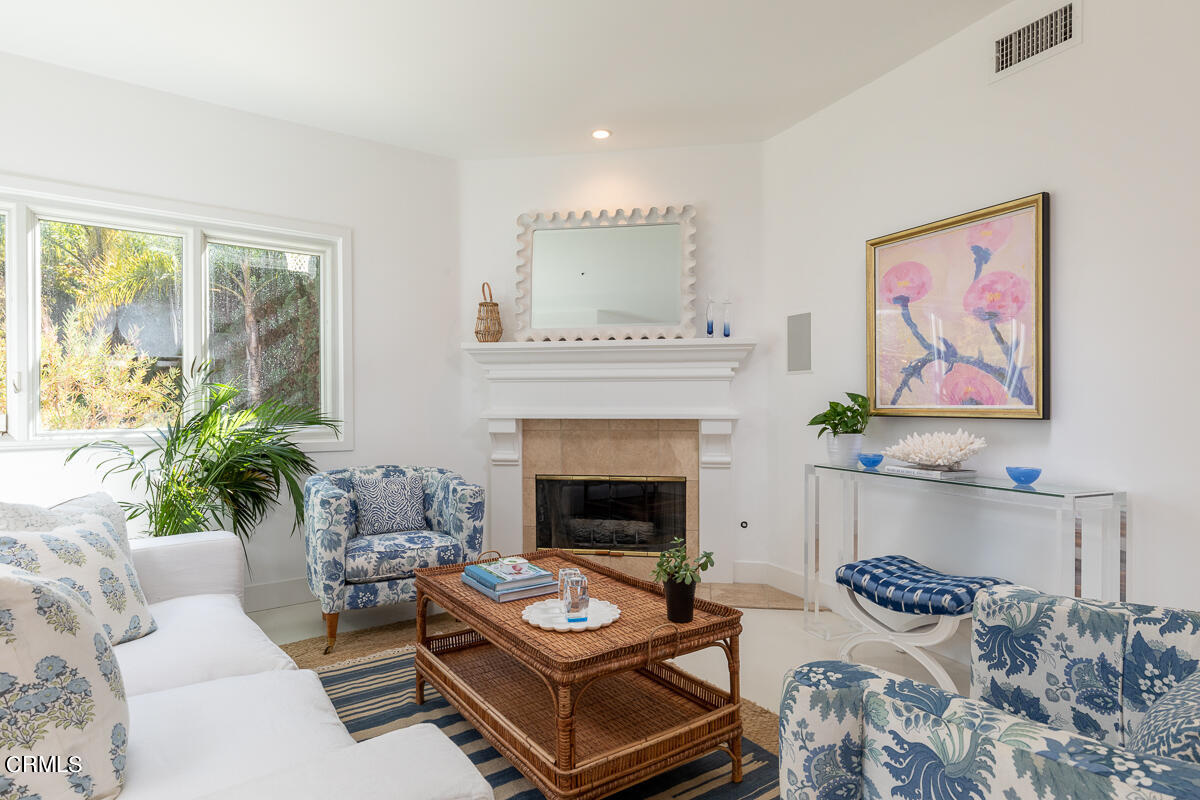 1437 Rutherford Drive Pasadena, CA 91103 - Photo 13 of 44 a living room with furniture and a fireplace