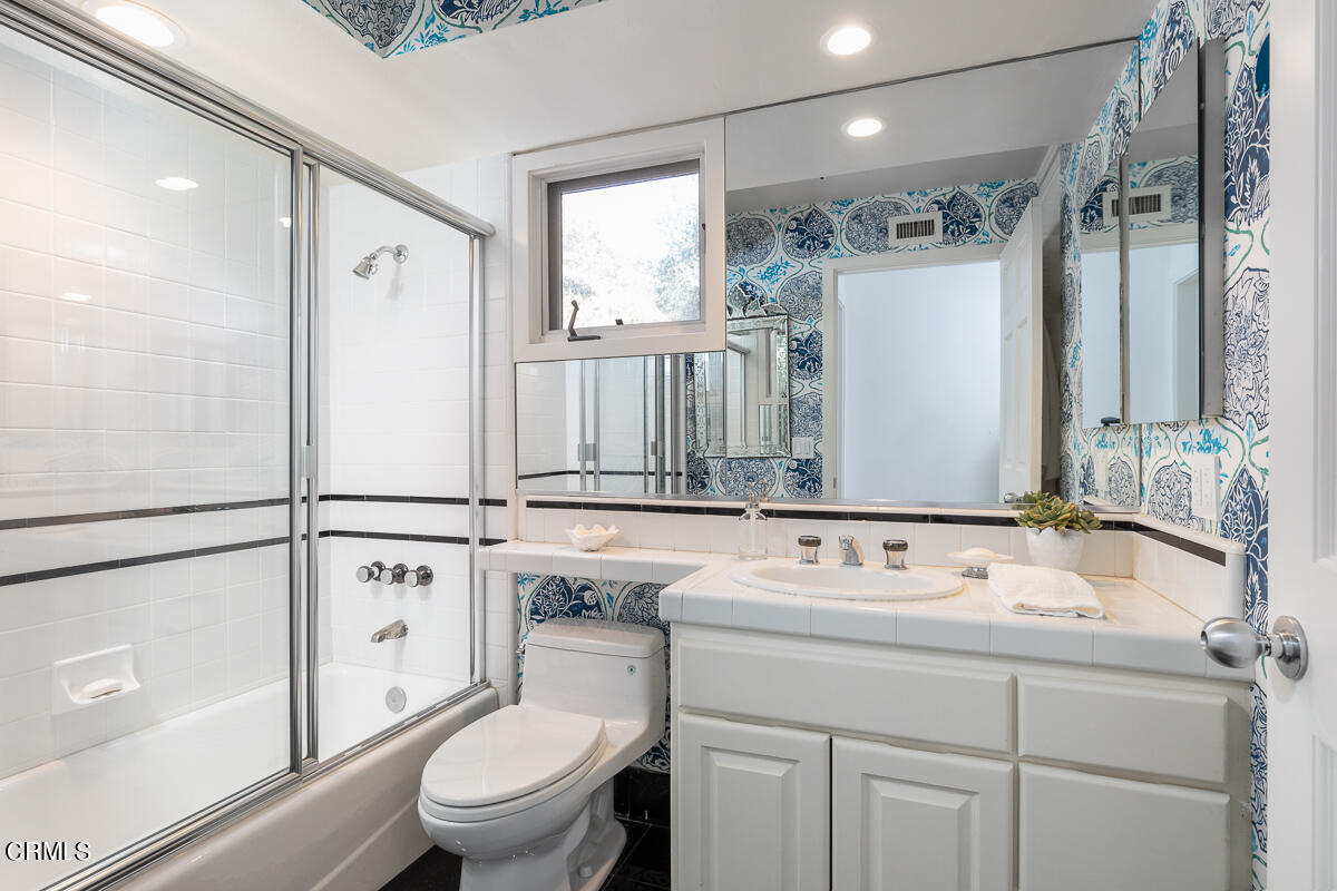 1437 Rutherford Drive Pasadena, CA 91103 - Photo 16 of 44 a bathroom with a sink a toilet and shower