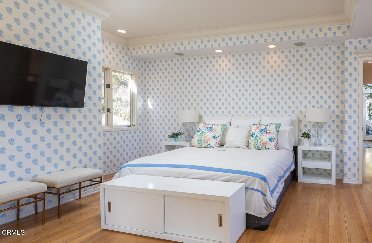 1437 Rutherford Drive Pasadena, CA 91103 - Photo 27 of 44 a bedroom with a bed and a flat screen tv