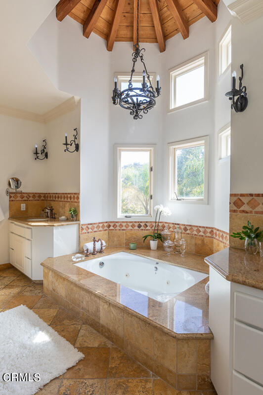 1437 Rutherford Drive Pasadena, CA 91103 - Photo 28 of 44 a bathroom with a tub sink and mirror