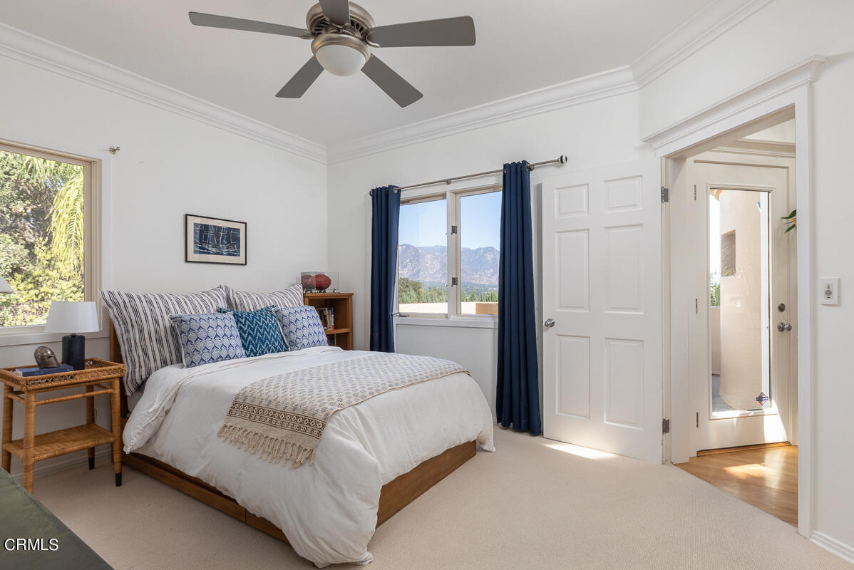 1437 Rutherford Drive Pasadena, CA 91103 - Photo 32 of 44 a bedroom with a large bed and a chandelier