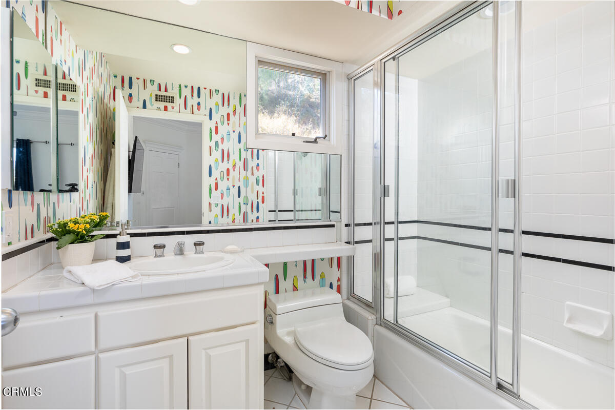 1437 Rutherford Drive Pasadena, CA 91103 - Photo 33 of 44 a bathroom with a sink a toilet and shower