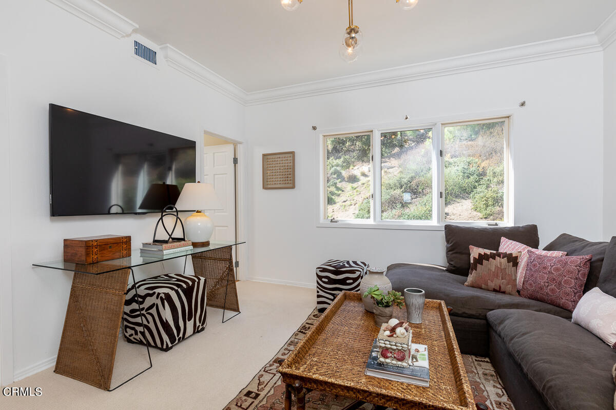 1437 Rutherford Drive Pasadena, CA 91103 - Photo 37 of 44 a living room with furniture and a flat screen tv