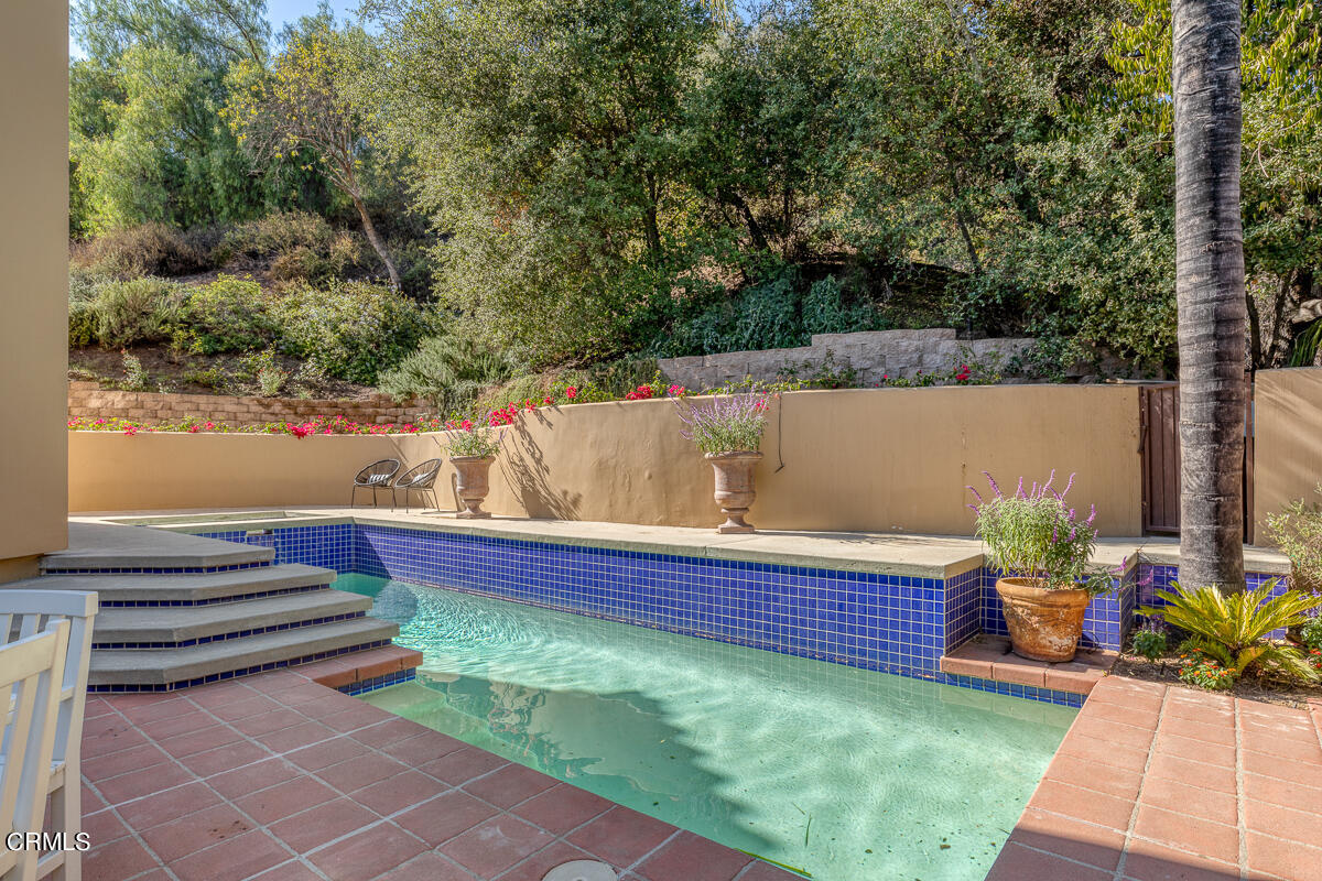 1437 Rutherford Drive Pasadena, CA 91103 - Photo 41 of 44 a view of outdoor sitting area with swimming pool and trees in the background