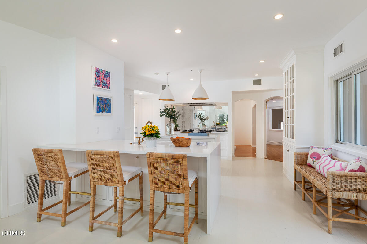 1437 Rutherford Drive Pasadena, CA 91103 - Photo 9 of 44 a dining hall with stainless steel appliances kitchen island granite countertop a dining table and chairs